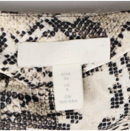 H&amp;M- Ormskinnsm�nstrad kjol - stl.36