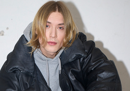Man in a big black puffer coat.